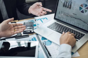 Two SEO consultants discussing the SEO metrics they have been tracking