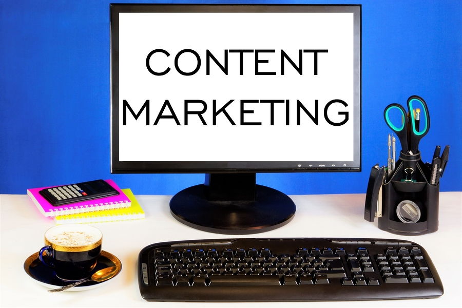 Picture of a desktop pc with content marketing on a word document in large letters
