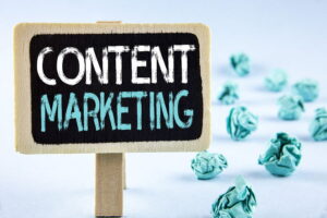 Picture of a blackboard sign with content marketing written on it in different coloured chalk